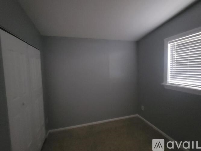 A room with a window on the right side.