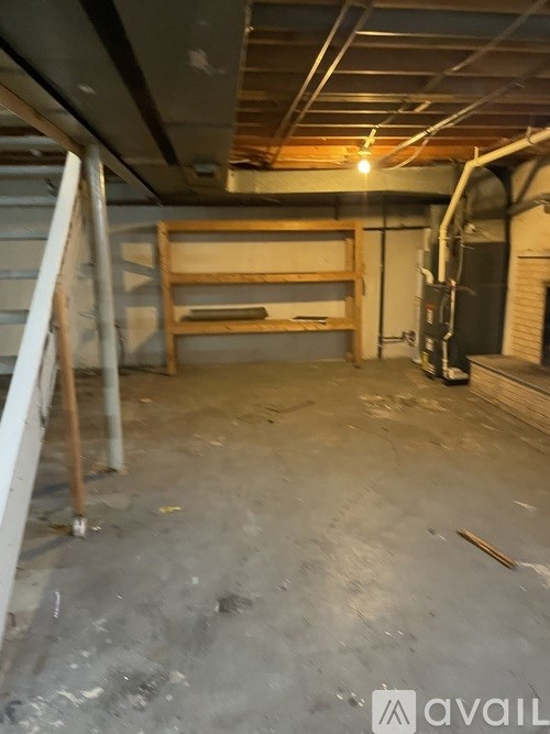 A room with a bed and a desk in it.