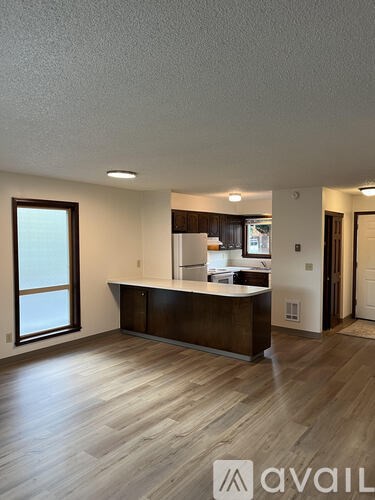 A reception area with a desk and a window.