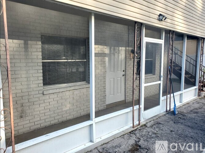 A house with a white door and windows is for sale.