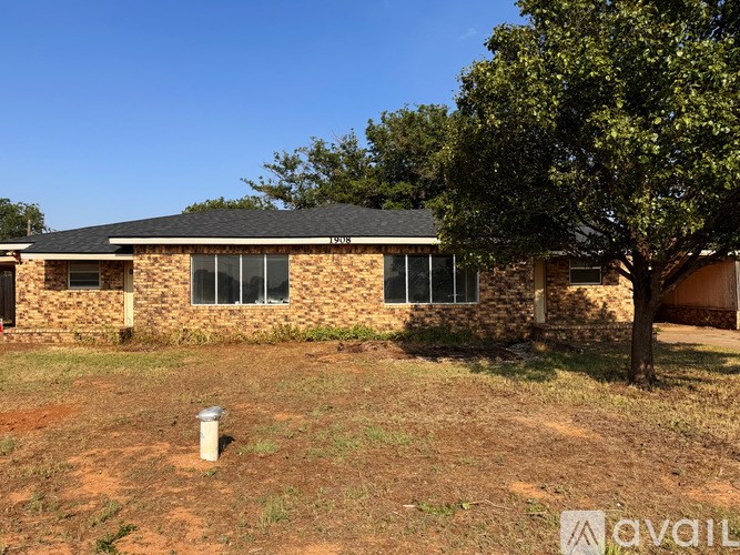 A house with a tree in front of it.