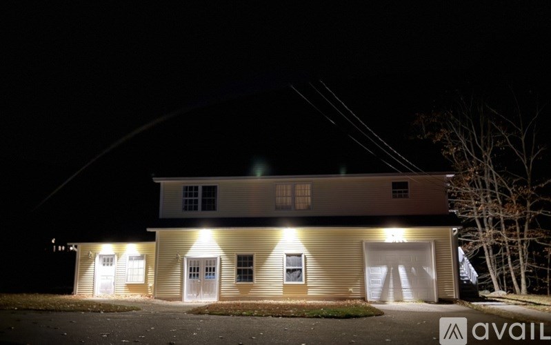 A house with a lit up sign that says "available" in front of it.
