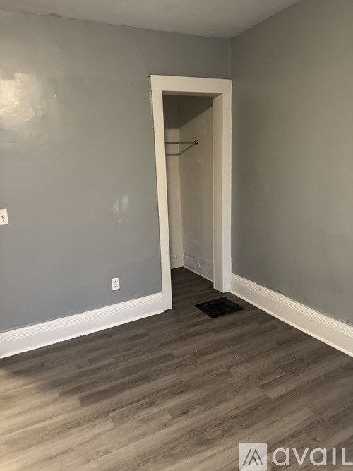 A room with a doorway leading to another room.