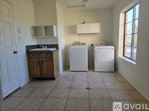 A laundry room with a washer and dryer.