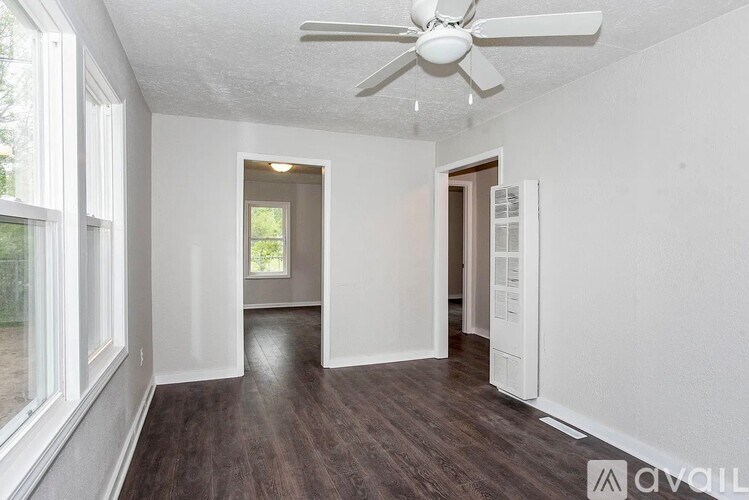A kitchen with a stainless steel refrigerator, microwave, and stove.
