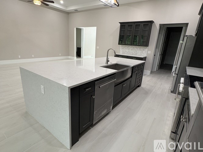 A modern kitchen with a large island in the middle.