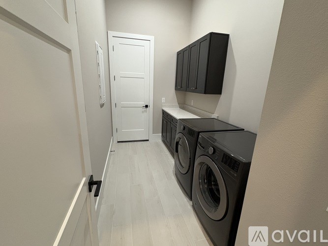 A laundry room with a washer and dryer.