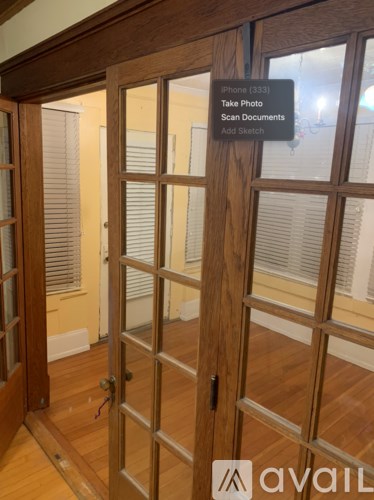 A wooden door with a sign on it that says "Phone (333) Take Photo Scan Documents Add Sketch".