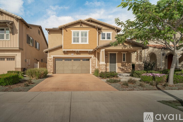 A house with a driveway in front of it.