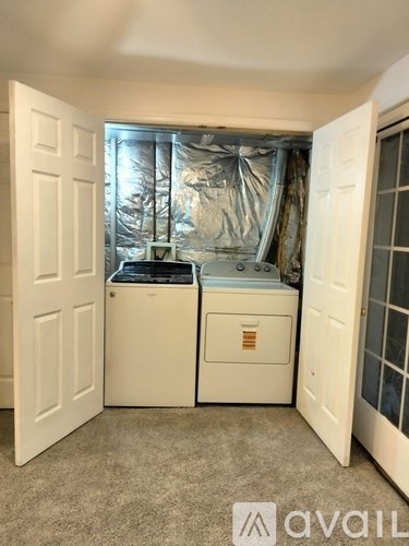 A small white bathroom with a toilet and sink.