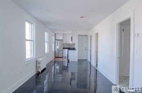 A spacious kitchen with a dining area and a large island.