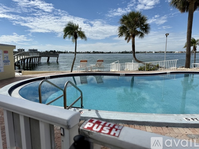 A pool with a sign that says "push" on the railing.