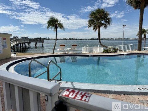 A pool with a sign that says "push" on the railing.