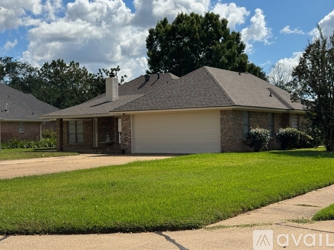A house with a garage is for sale.