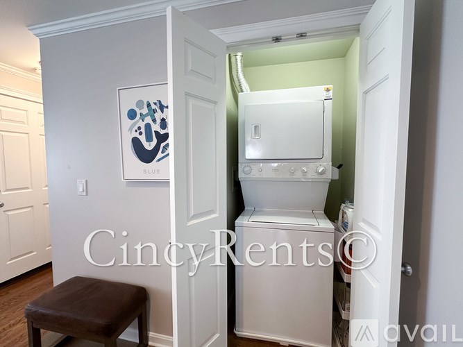 A bathroom with a toilet and a stool.