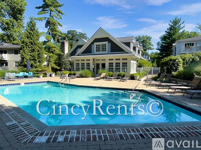 A large house with a pool in front of it.