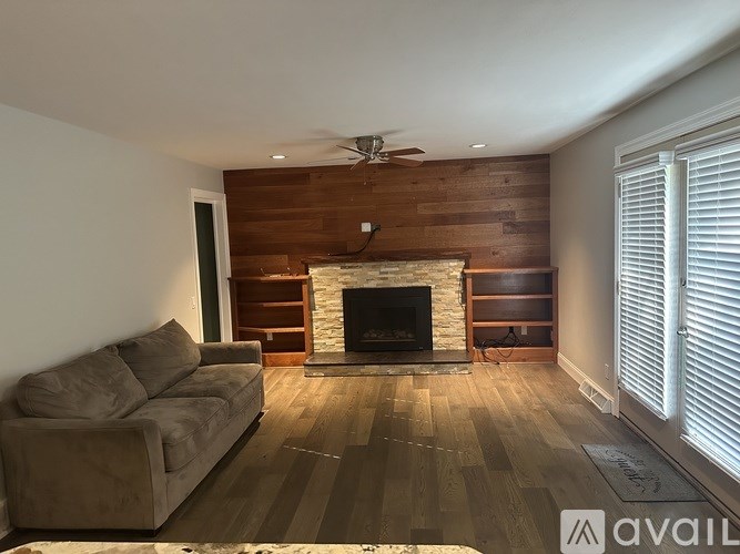 A living room with a fireplace and a couch.