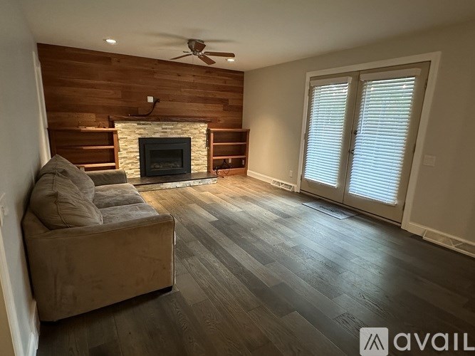 A living room with a fireplace and a couch.