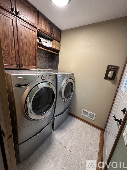 A laundry room with a washer and dryer.