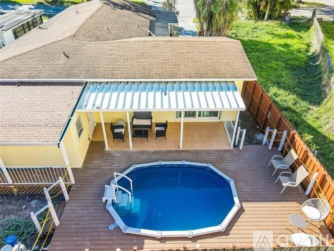 A house with a pool in the backyard.