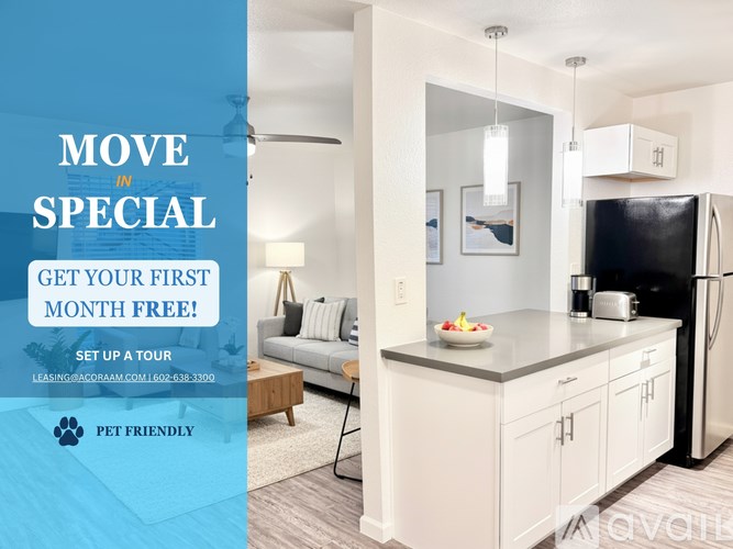 A modern kitchen with a black fridge and white cabinets.