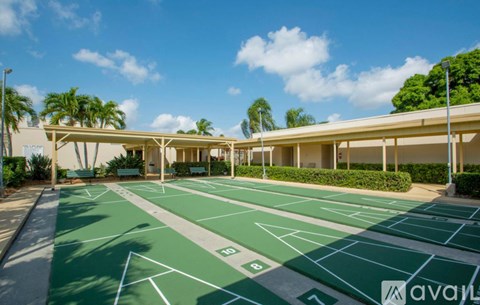 A parking lot with green lines and a white sign that says "available" on it.