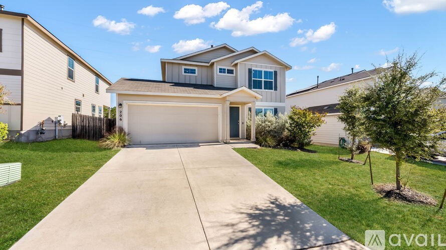 A house with a garage is available for sale.