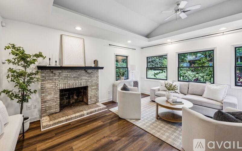 A living room with a fireplace and a couch.