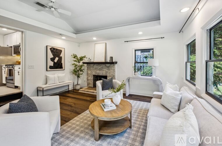 A living room with a fireplace and a couch.