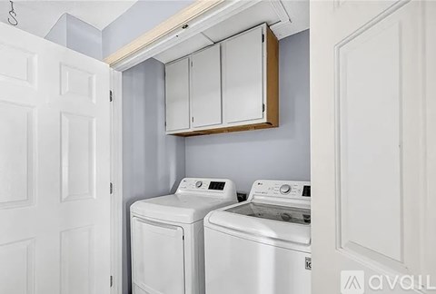 A laundry room with a washer and dryer.