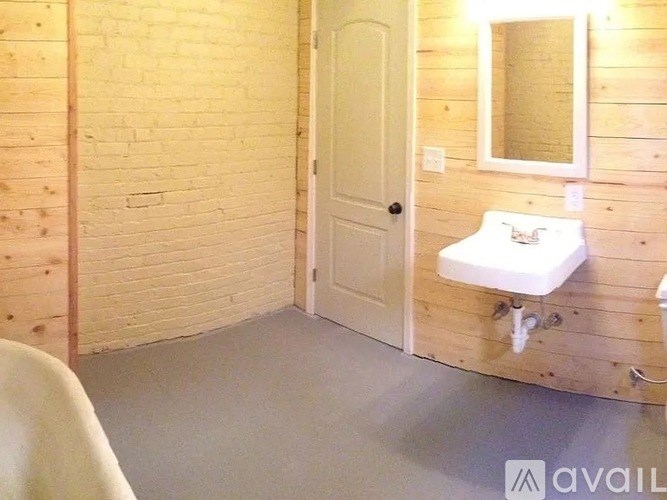 A bathroom with a sink and toilet.