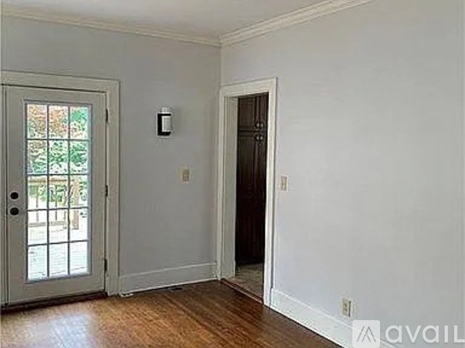 A room with a door and a window.