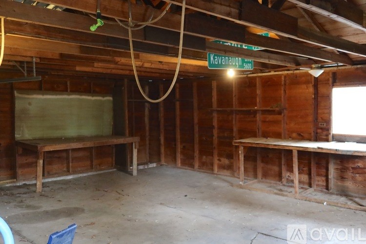 A room with wooden walls and a sign that reads "Kavanaugh".