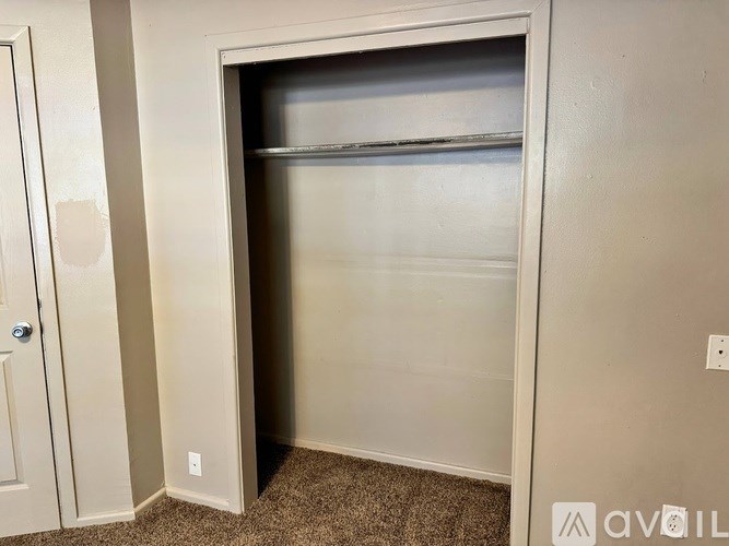 A white door with a glass window is open.