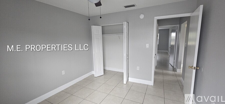 A room with the text M.E. PROPERTIES LLC on the wall.