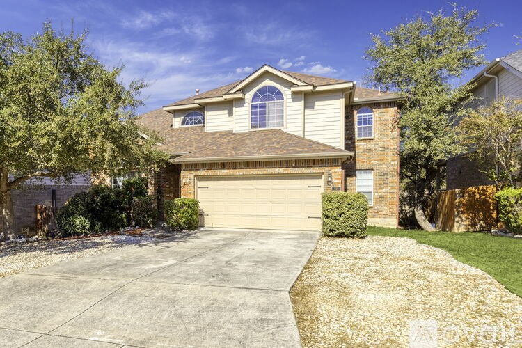 A house with a garage and a driveway.
