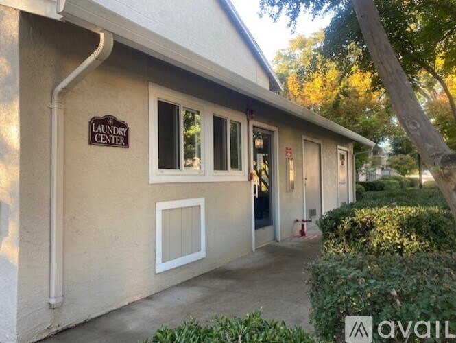 A building with a sign that says Laundry Center.