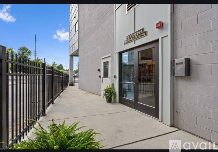 A building with a sign that says "AVAILABLE" on the side of it.