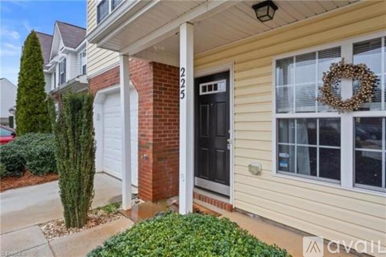 A house numbered 225 with a wreath on the door.