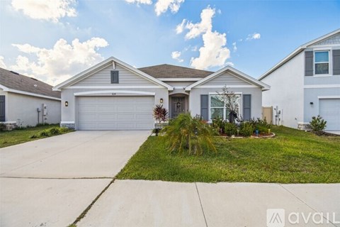 A house with a driveway in front of it.