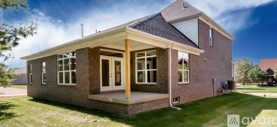 A house with a porch and a covered entrance is for sale.