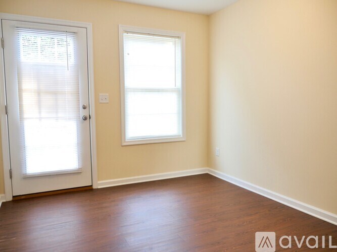 A room with a door and a window.