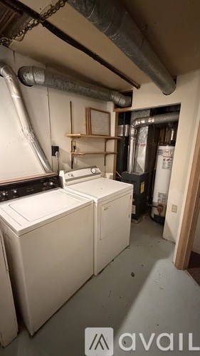 A laundry room with a washer and dryer.
