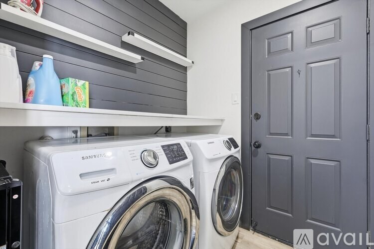A washer and dryer in a laundry room.