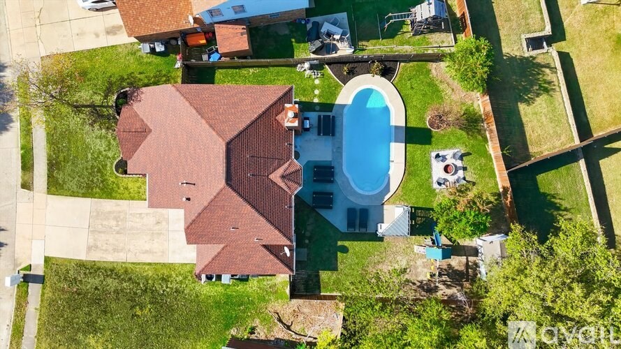 A house with a pool in the backyard.