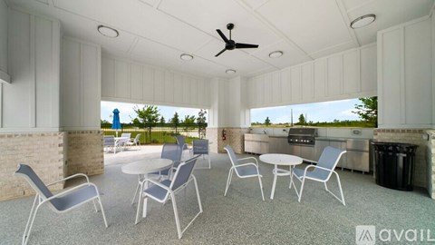 A patio with a table and chairs is available for rent.