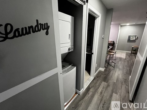 A laundry sign is on a wall in a room.
