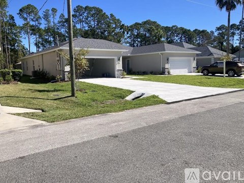 A house with a driveway in front of it.