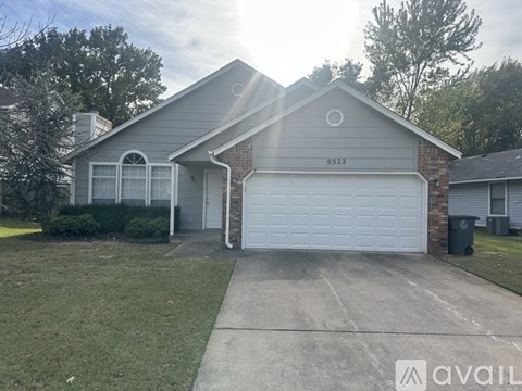 A house with the number 9332 on the side is for sale.