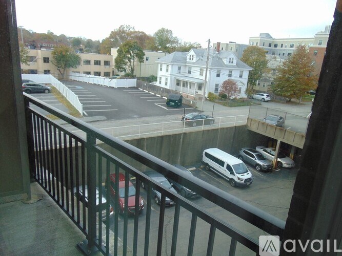 A parking lot with cars and a white van.